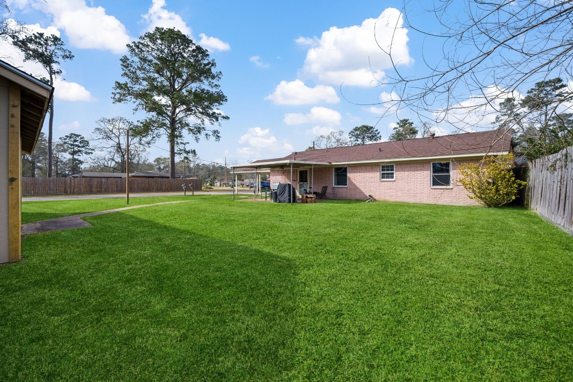 400 Dora Street Cleveland, TX 77328 - Photo 6 of 19 a view of house with a big yard