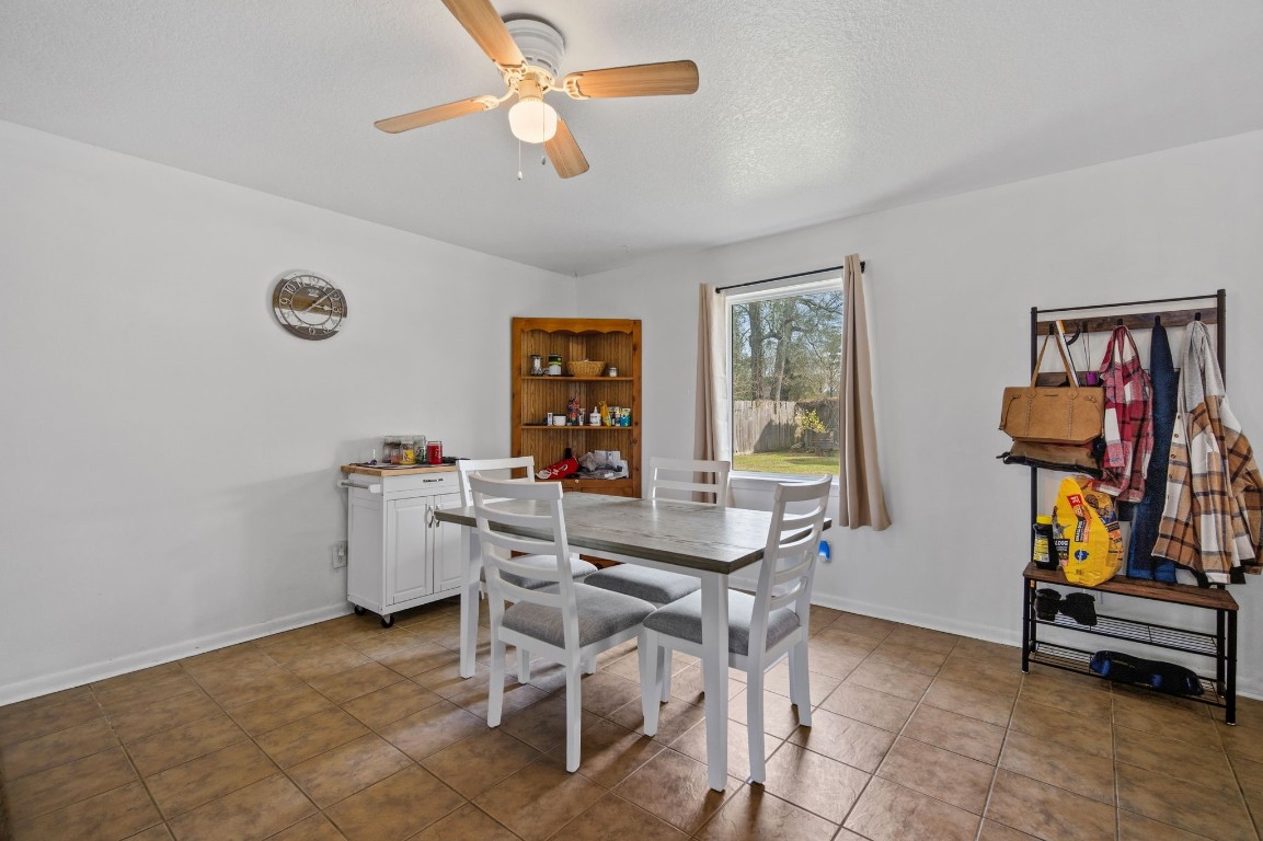 400 Dora Street Cleveland, TX 77328 - Photo 9 of 19 a view of a dining room with furniture and a window