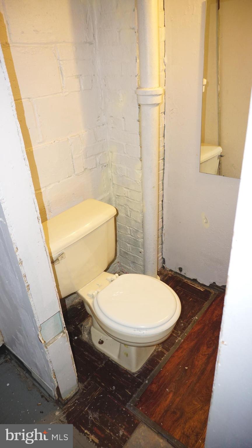 3436 Dunran Road Dundalk, MD 21222 - Photo 15 of 25 a bathroom with a toilet and a sink