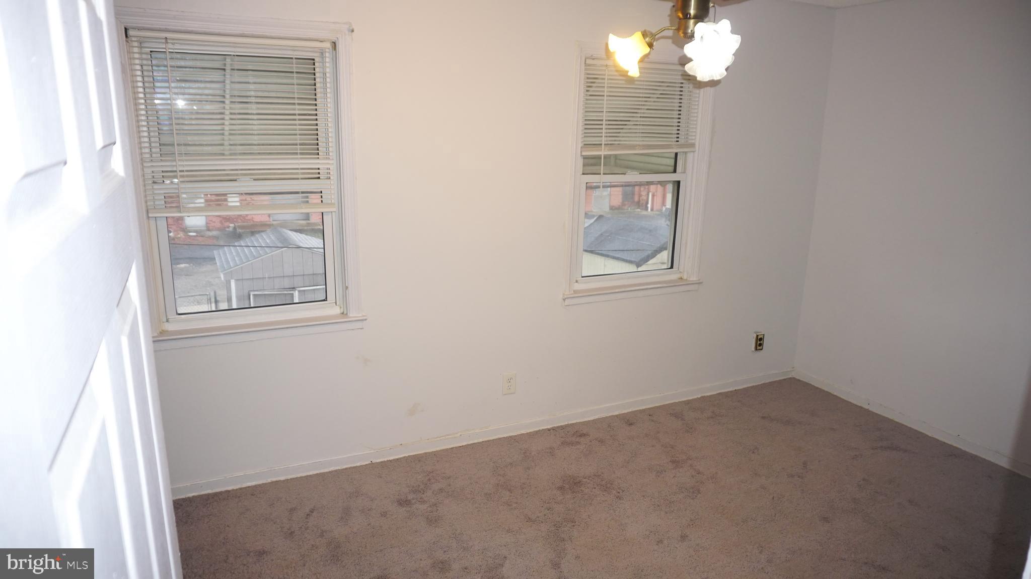 3436 Dunran Road Dundalk, MD 21222 - Photo 23 of 25 an empty room with windows