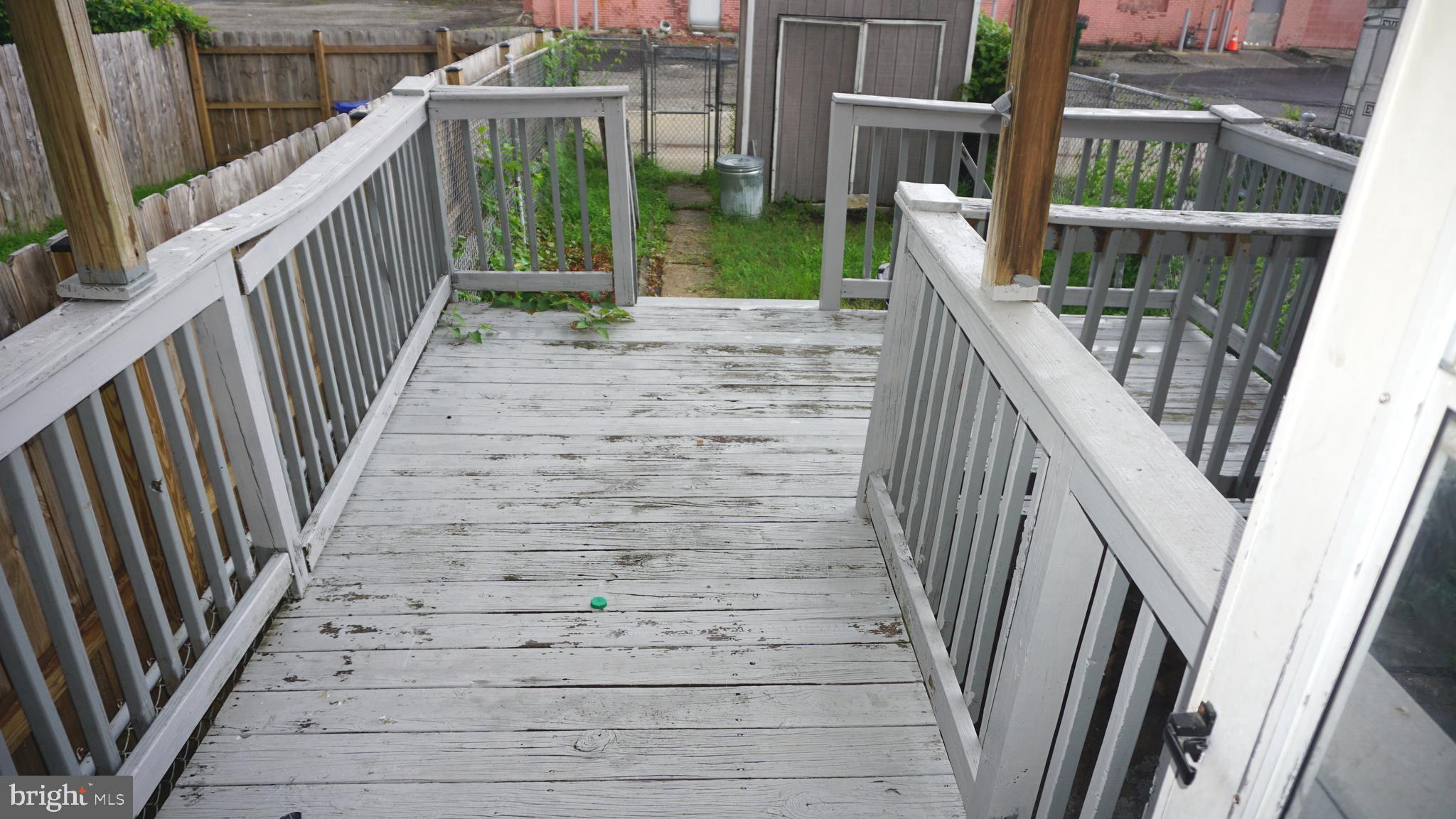 3436 Dunran Road Dundalk, MD 21222 - Photo 24 of 25 a view of stairs with wooden floor and fence