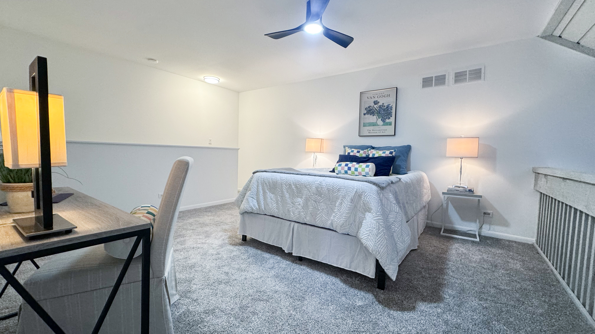 583 Dunham Road Gurnee, IL 60031 - Photo 15 of 25 a bedroom with a bed a couch and a flat tv screen on the dresser