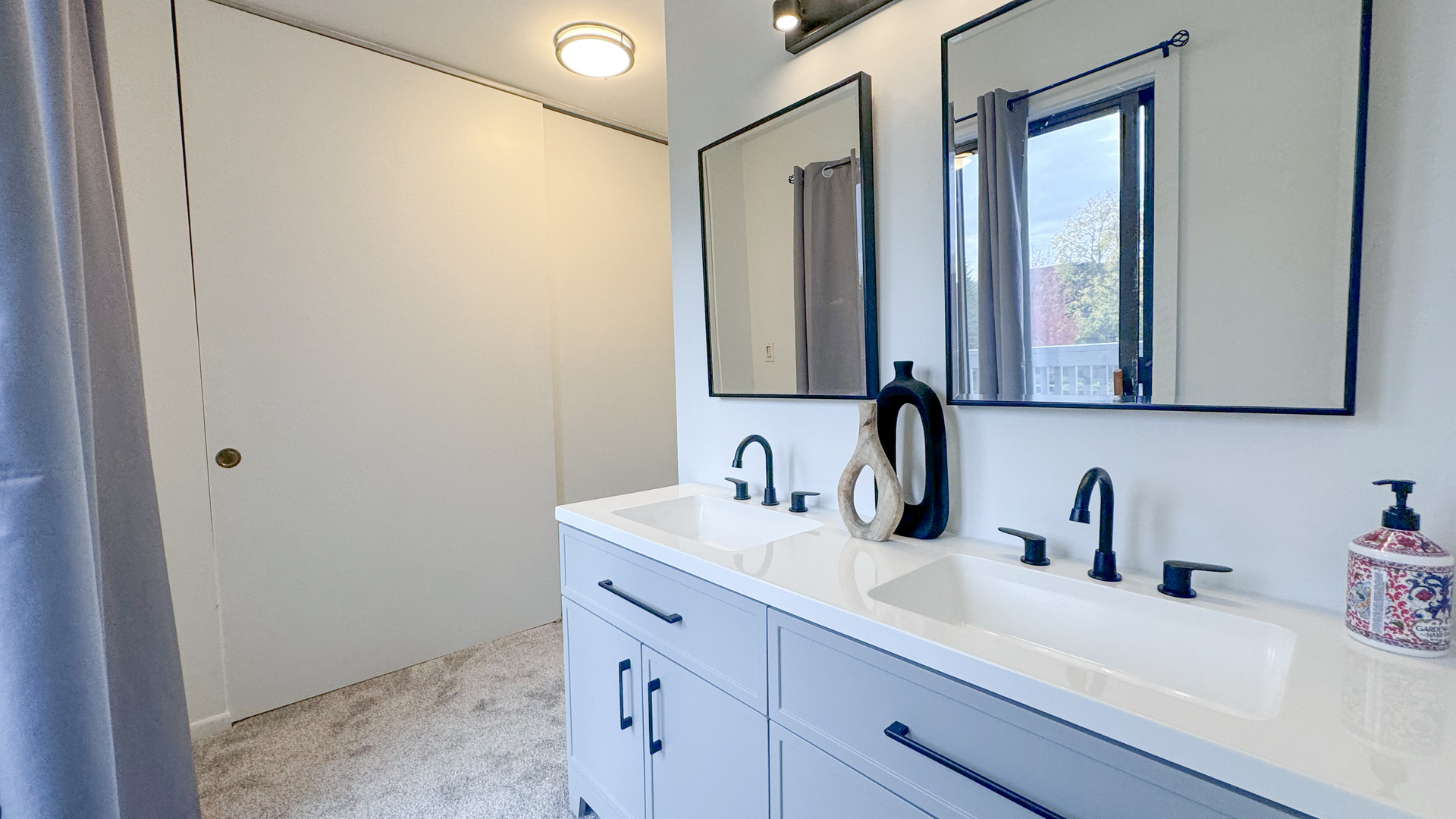 583 Dunham Road Gurnee, IL 60031 - Photo 17 of 25 a bathroom with a sink and a mirror