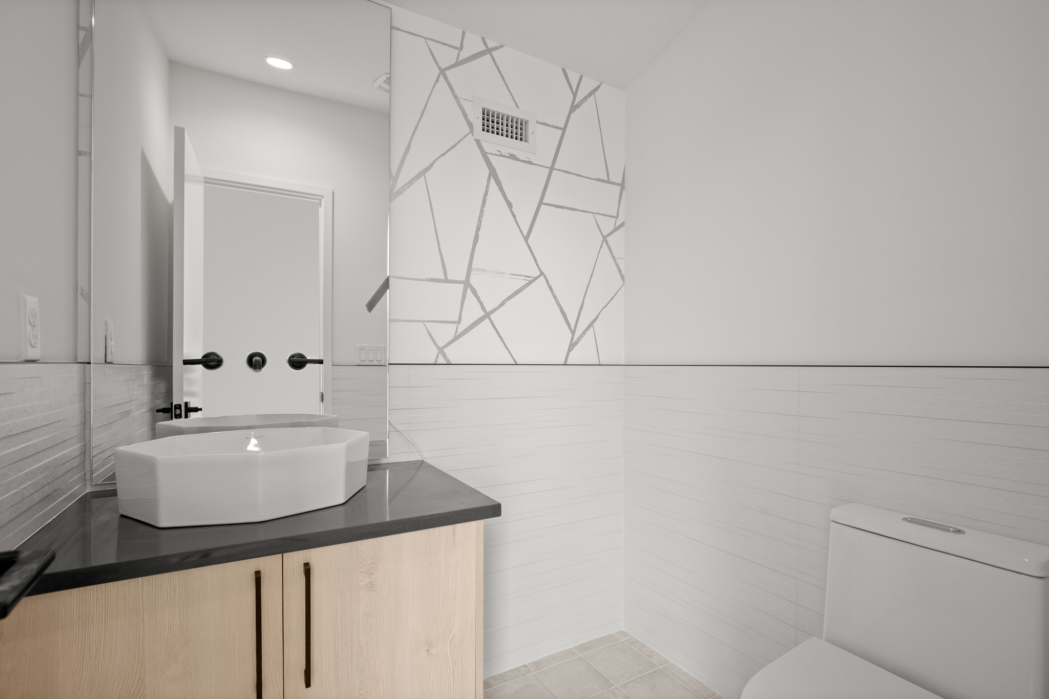 2215 South 3rd Street Austin, TX 78704 - Photo 27 of 38 a bathroom with a sink a toilet and mirror