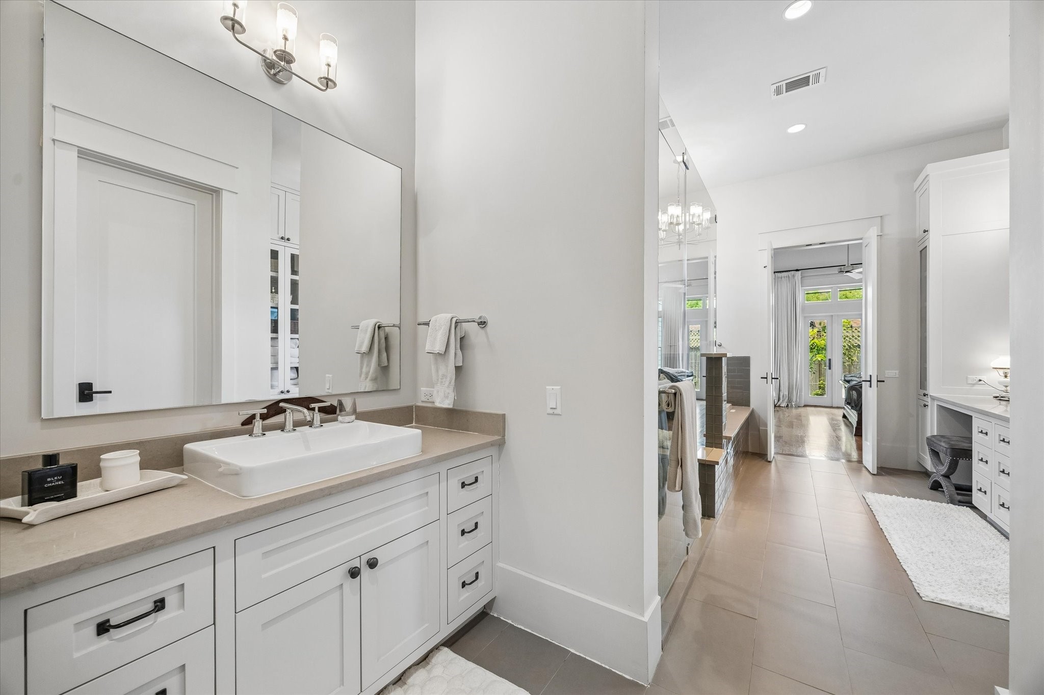 1101 Omar Street Houston, TX 77009 - Photo 23 of 46 Additional vanity and storage areas connect seamlessly to the oversized walk-in closet, offering exceptional organization, extra storage, and a true boutique-style dressing experience.