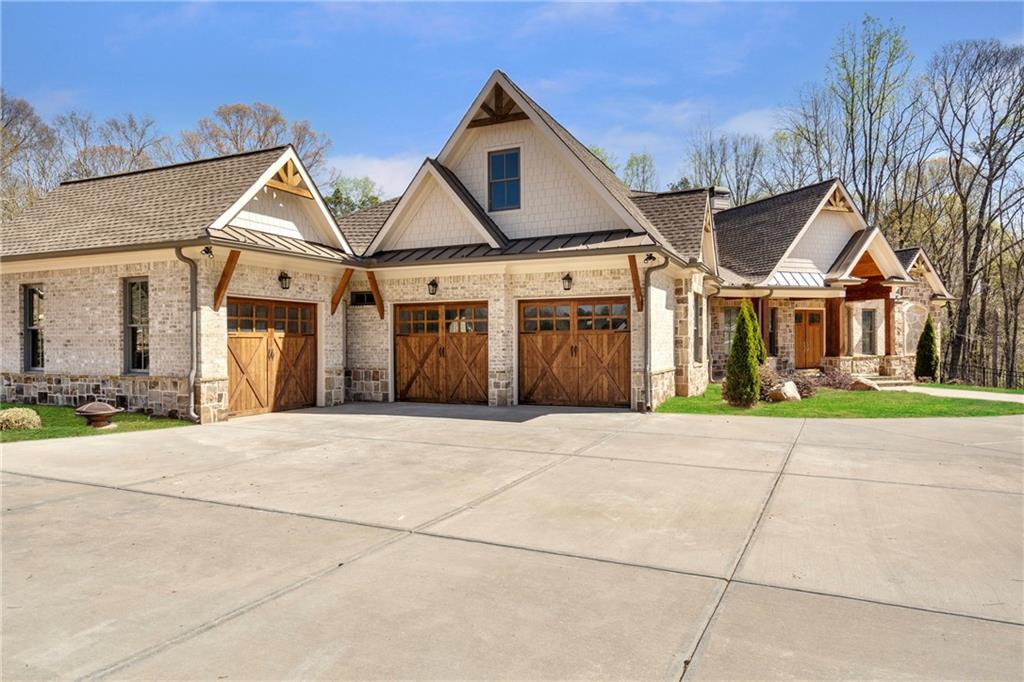 254 Fortress Way Jefferson, GA 30549 - Photo 12 of 69 a front view of a house with a yard and garage