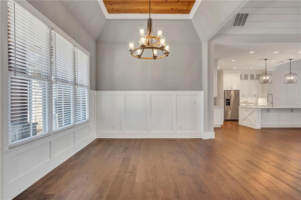 254 Fortress Way Jefferson, GA 30549 - Photo 16 of 69 a view of a livingroom with wooden floor and a large window