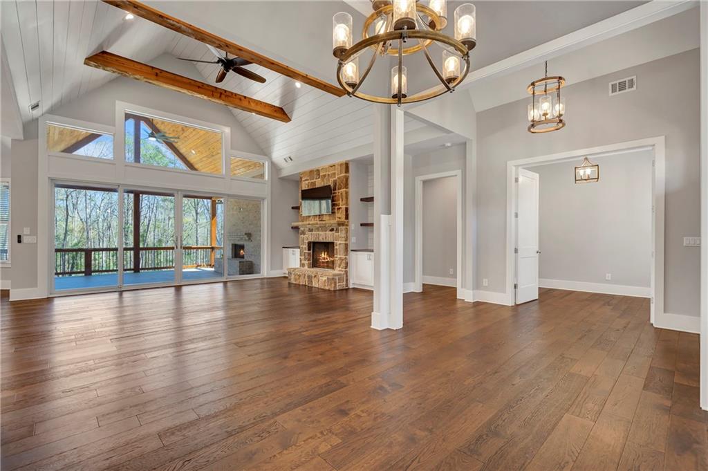254 Fortress Way Jefferson, GA 30549 - Photo 17 of 69 a view of an empty room with wooden floor and a window
