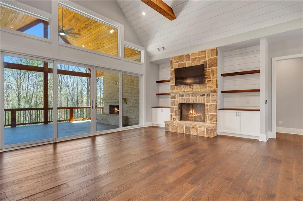 254 Fortress Way Jefferson, GA 30549 - Photo 18 of 69 a view of an empty room with wooden floor and a window
