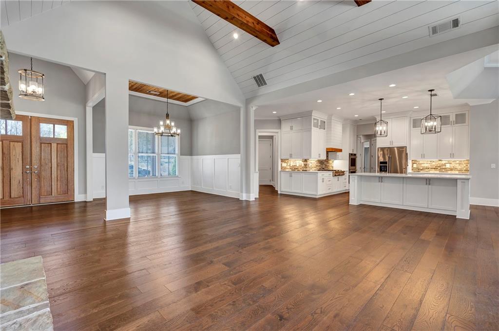 254 Fortress Way Jefferson, GA 30549 - Photo 20 of 69 a view of a living room kitchen with furniture and wooden floor