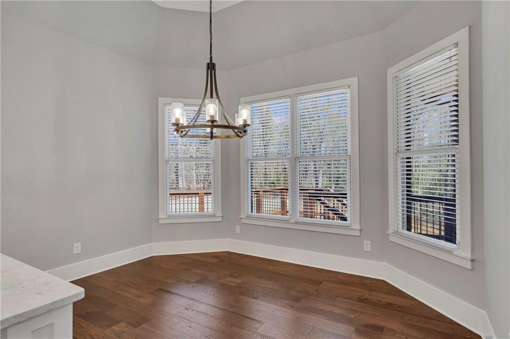 254 Fortress Way Jefferson, GA 30549 - Photo 27 of 69 a view of an empty room with wooden floor and a window