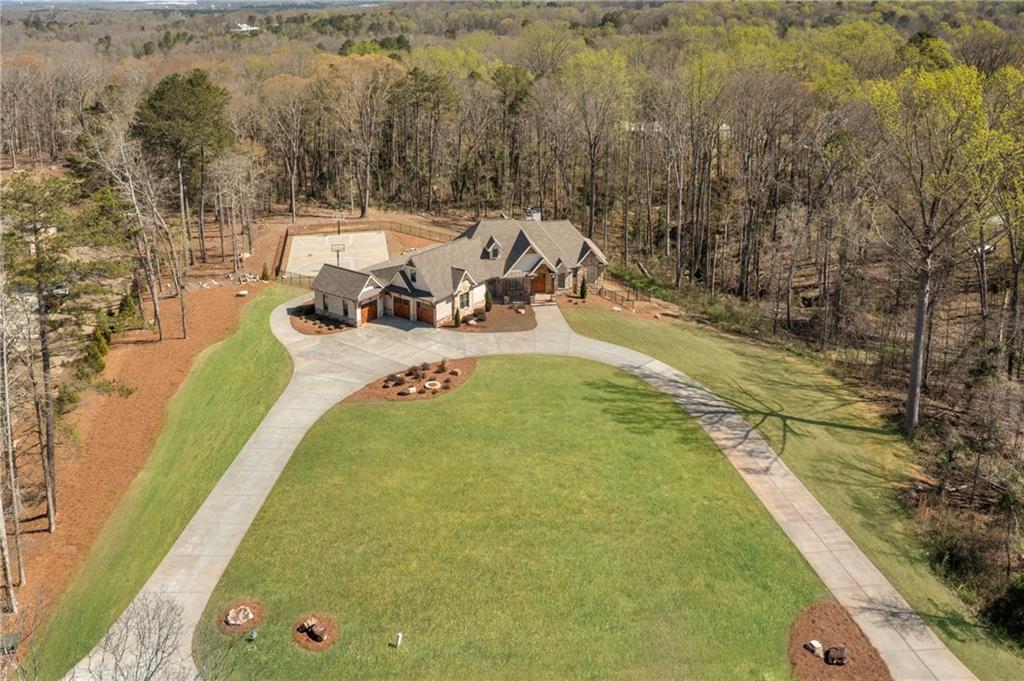 254 Fortress Way Jefferson, GA 30549 - Photo 4 of 69 a view of a swimming pool with a yard and sitting area