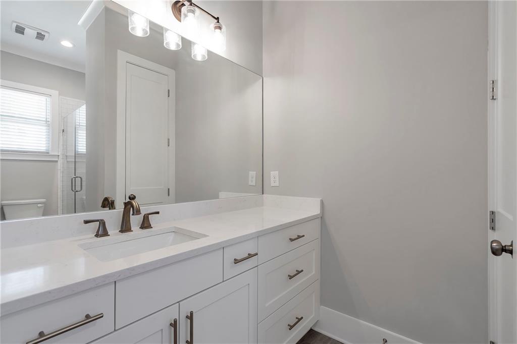 254 Fortress Way Jefferson, GA 30549 - Photo 43 of 69 a bathroom with a sink and a mirror