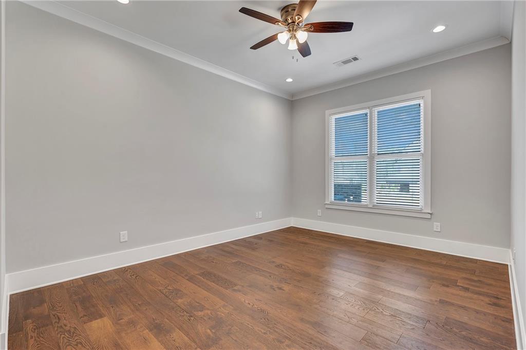 254 Fortress Way Jefferson, GA 30549 - Photo 44 of 69 a view of an empty room with a window and a chandelier fan