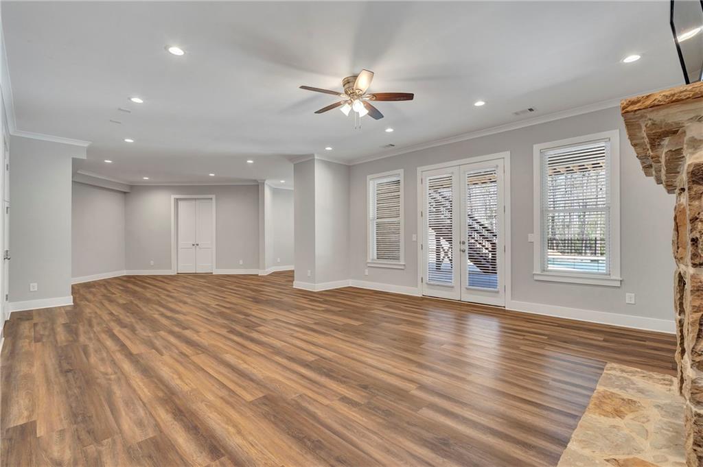 254 Fortress Way Jefferson, GA 30549 - Photo 49 of 69 a view of an empty room with wooden floor and a window