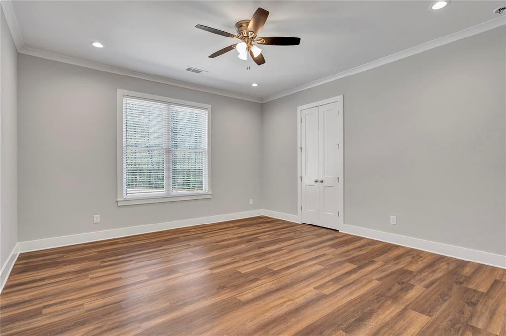 254 Fortress Way Jefferson, GA 30549 - Photo 51 of 69 a view of empty room with wooden floor and fan