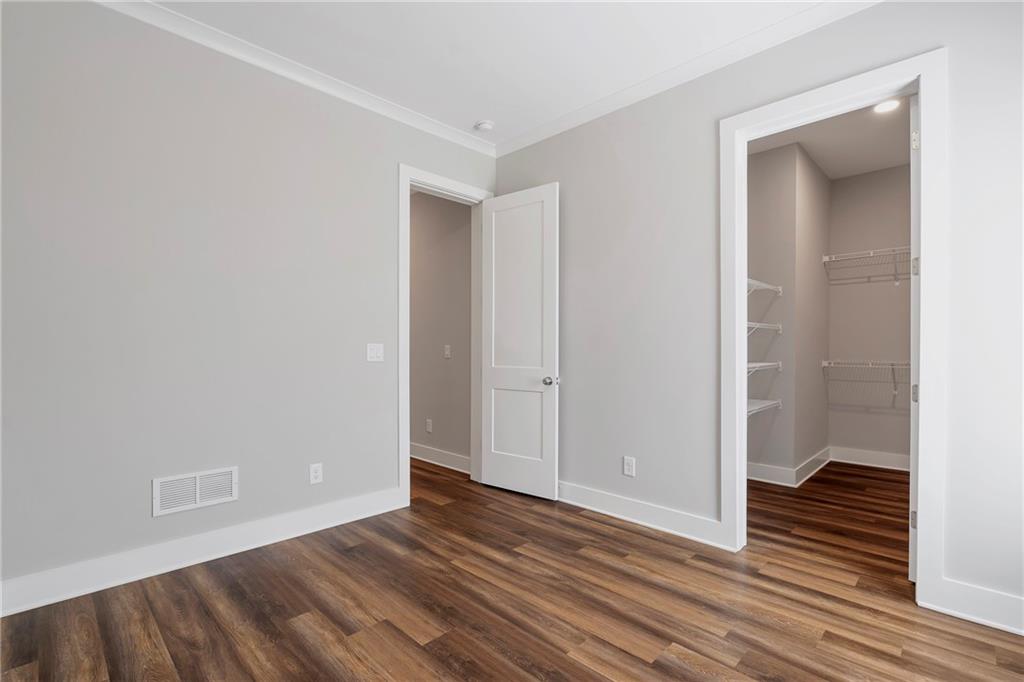 254 Fortress Way Jefferson, GA 30549 - Photo 54 of 69 a view of a room with wooden floor and a bathroom