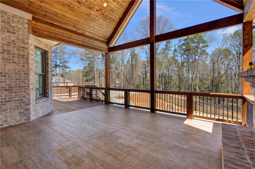 254 Fortress Way Jefferson, GA 30549 - Photo 57 of 69 a view of an empty room with wooden floor and floor to ceiling window