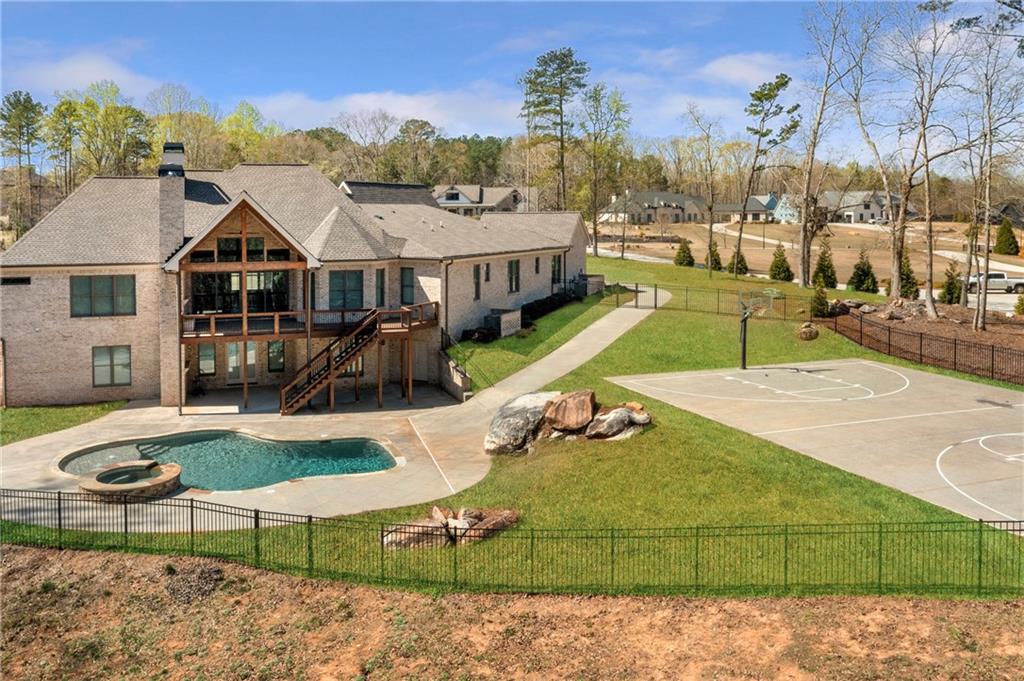 254 Fortress Way Jefferson, GA 30549 - Photo 7 of 69 a view of a house with swimming pool and sitting area