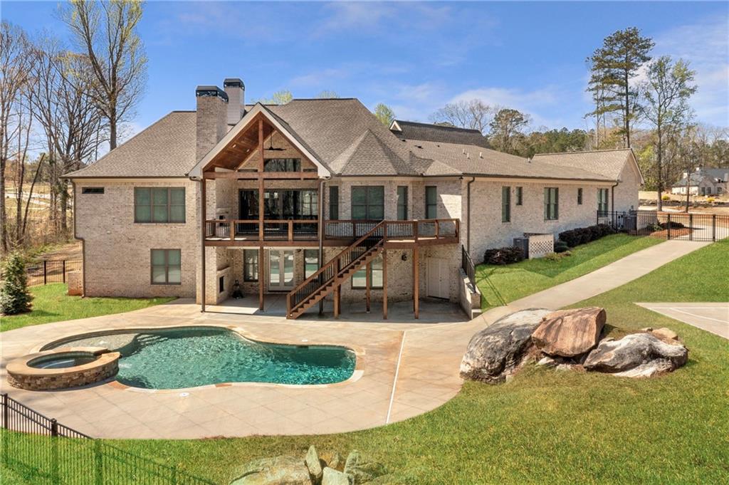 254 Fortress Way Jefferson, GA 30549 - Photo 8 of 69 a view of a house with a yard patio and fire pit