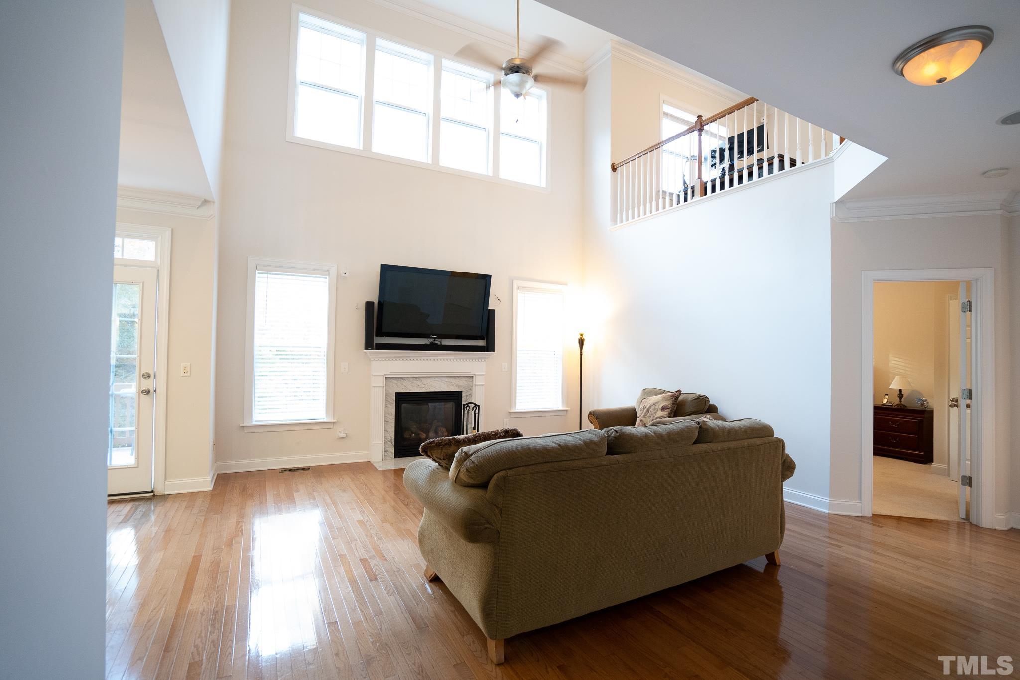 2237 Dunlin Lane Raleigh, NC 27614 - Photo 5 of 13 a living room with furniture and a flat screen tv
