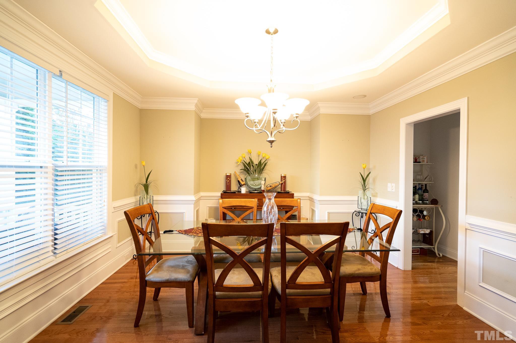 2237 Dunlin Lane Raleigh, NC 27614 - Photo 6 of 13 a view of a dining room with furniture and wooden floor
