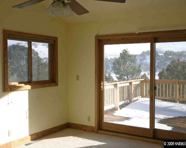 4870 Calavaras Road Reno, NV 89521 - Photo 8 of 9 a view of a glass door with a yard