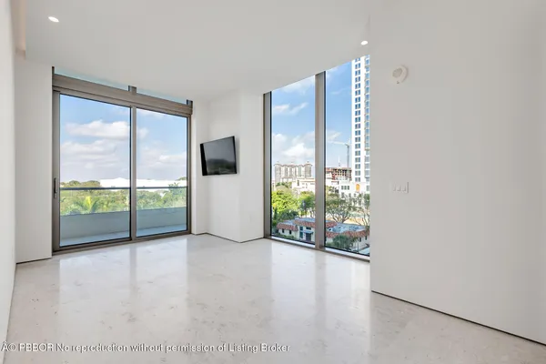 a view of empty room with floor to ceiling window