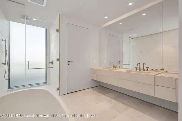 a bathroom with a bathtub and a sink