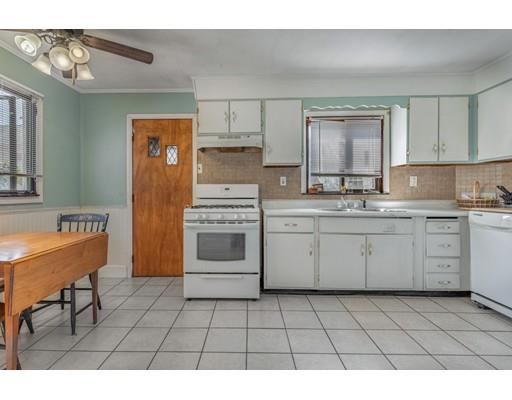14 Woodbine Road Medford, MA 02155 - Photo 14 of 26 a kitchen with a stove a sink and a refrigerator