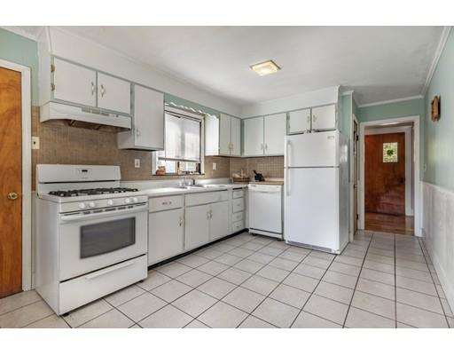 14 Woodbine Road Medford, MA 02155 - Photo 15 of 26 a kitchen with a stove a sink and a refrigerator