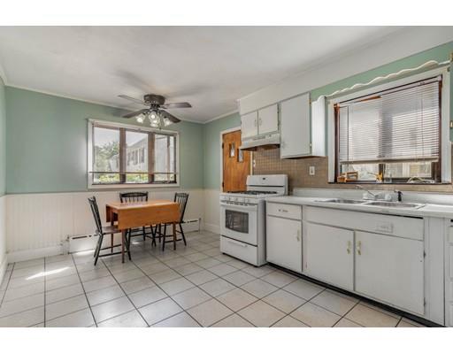 14 Woodbine Road Medford, MA 02155 - Photo 16 of 26 a open kitchen with granite countertop a sink cabinets and stainless steel appliances