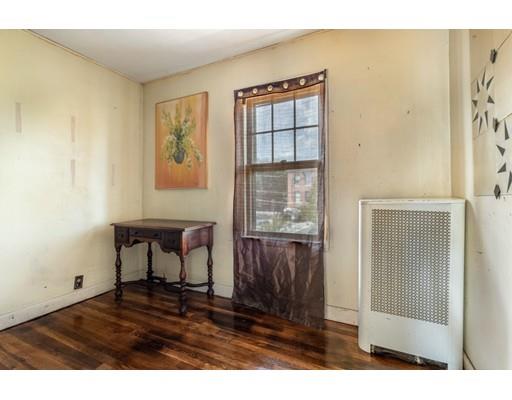 14 Woodbine Road Medford, MA 02155 - Photo 17 of 26 a room with furniture and a window