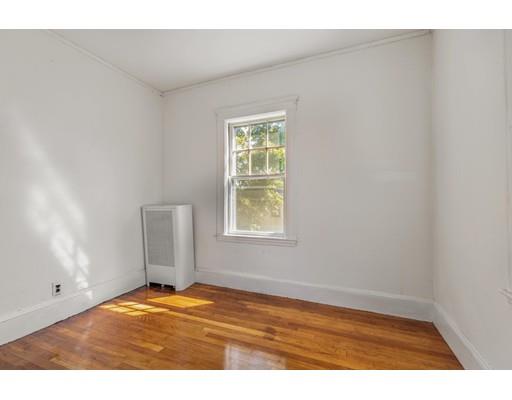 14 Woodbine Road Medford, MA 02155 - Photo 19 of 26 a view of empty room with wooden floor and fan