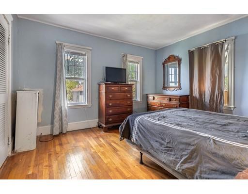 14 Woodbine Road Medford, MA 02155 - Photo 20 of 26 a bedroom with a bed and a window