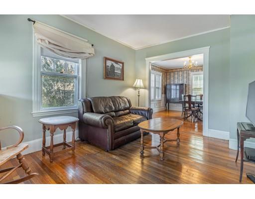 14 Woodbine Road Medford, MA 02155 - Photo 7 of 26 a living room with furniture a wooden floor and a large window