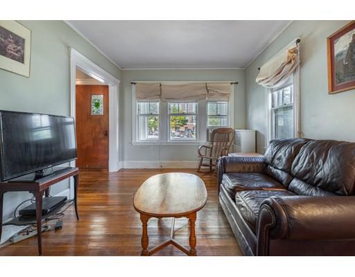 14 Woodbine Road Medford, MA 02155 - Photo 8 of 26 a living room with furniture a flat screen tv and a window