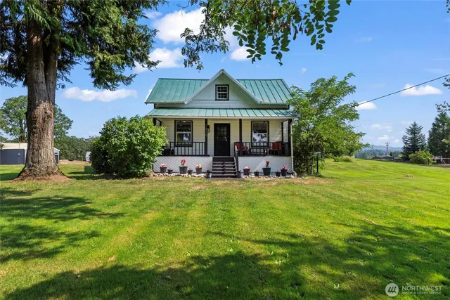 a front view of house with yard and green space