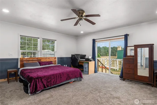 a bedroom with a bed and a table