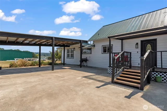 a view of back yard with a patio