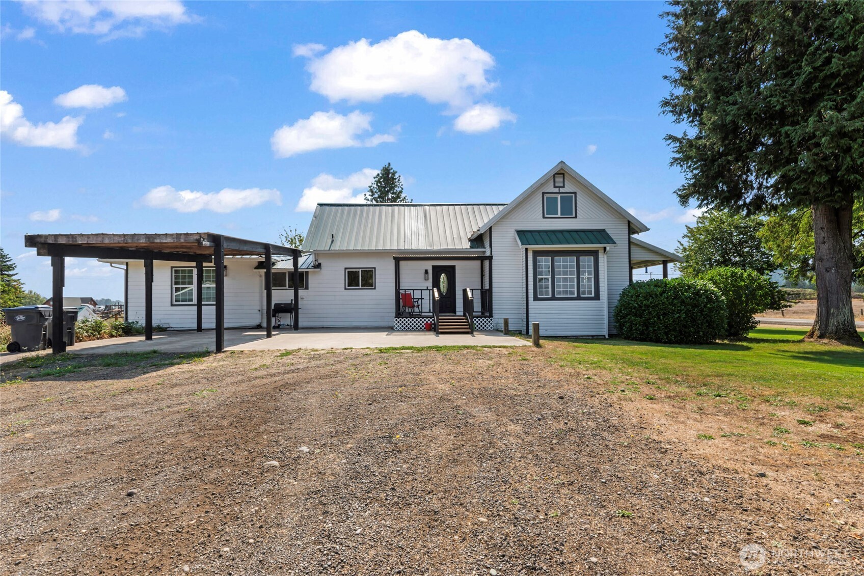 1855 South Bank Road Oakville, WA 98568 - Photo 7 of 22 a front view of a house with a yard and garage