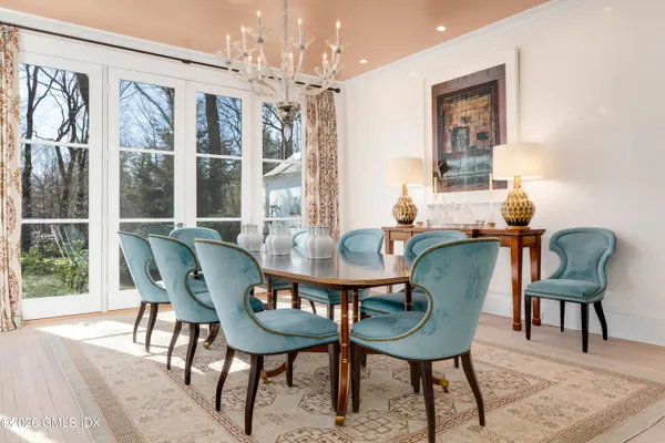 a living room with furniture bathtub and a chandelier