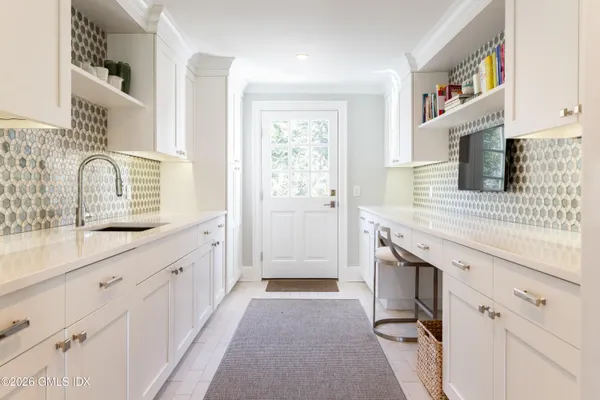 a spacious bedroom with two bed and a large window