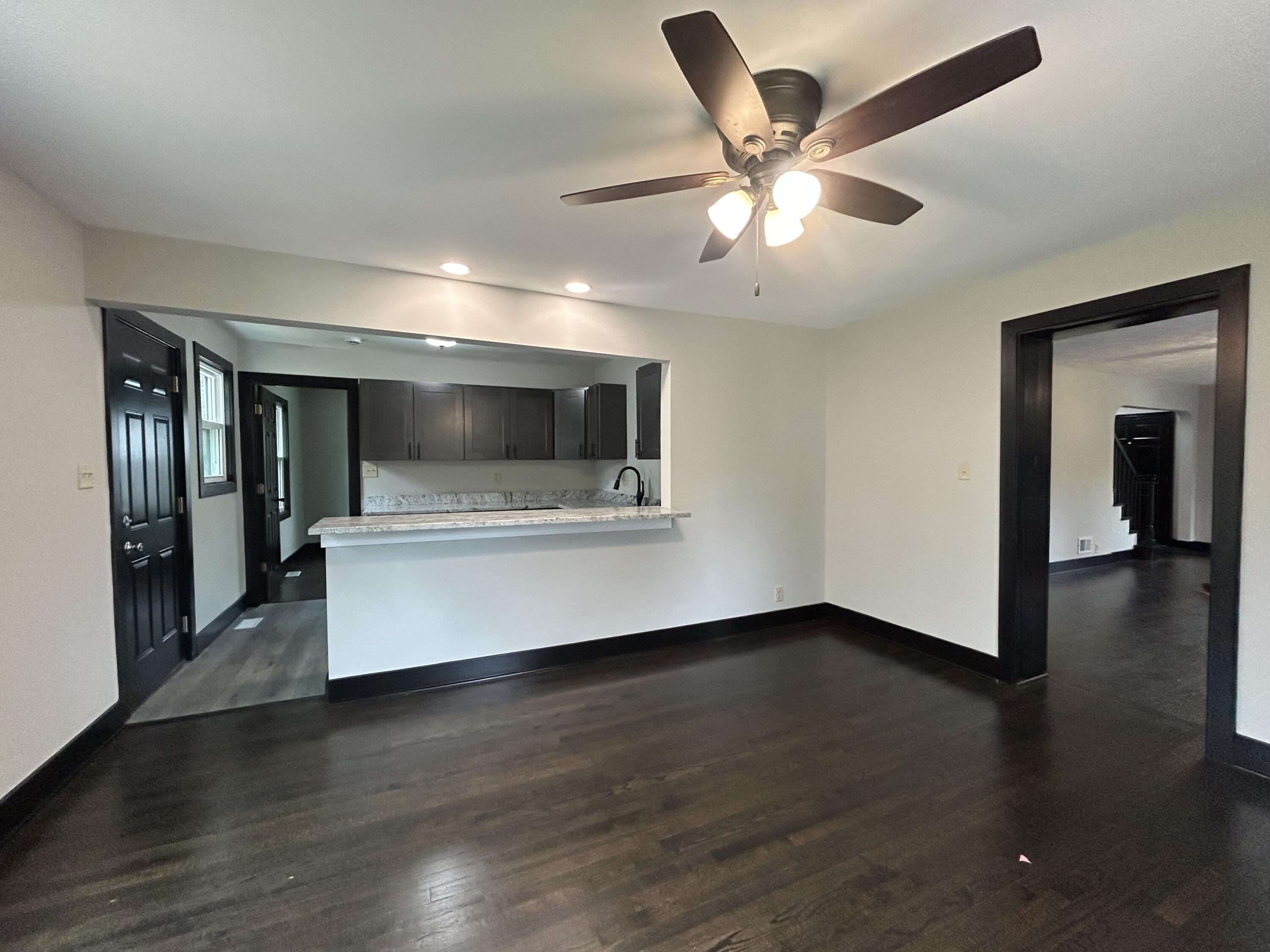 2264 Crest Road Gary, IN 46408 - Photo 26 of 86 a view of an empty room with wooden floor and a window