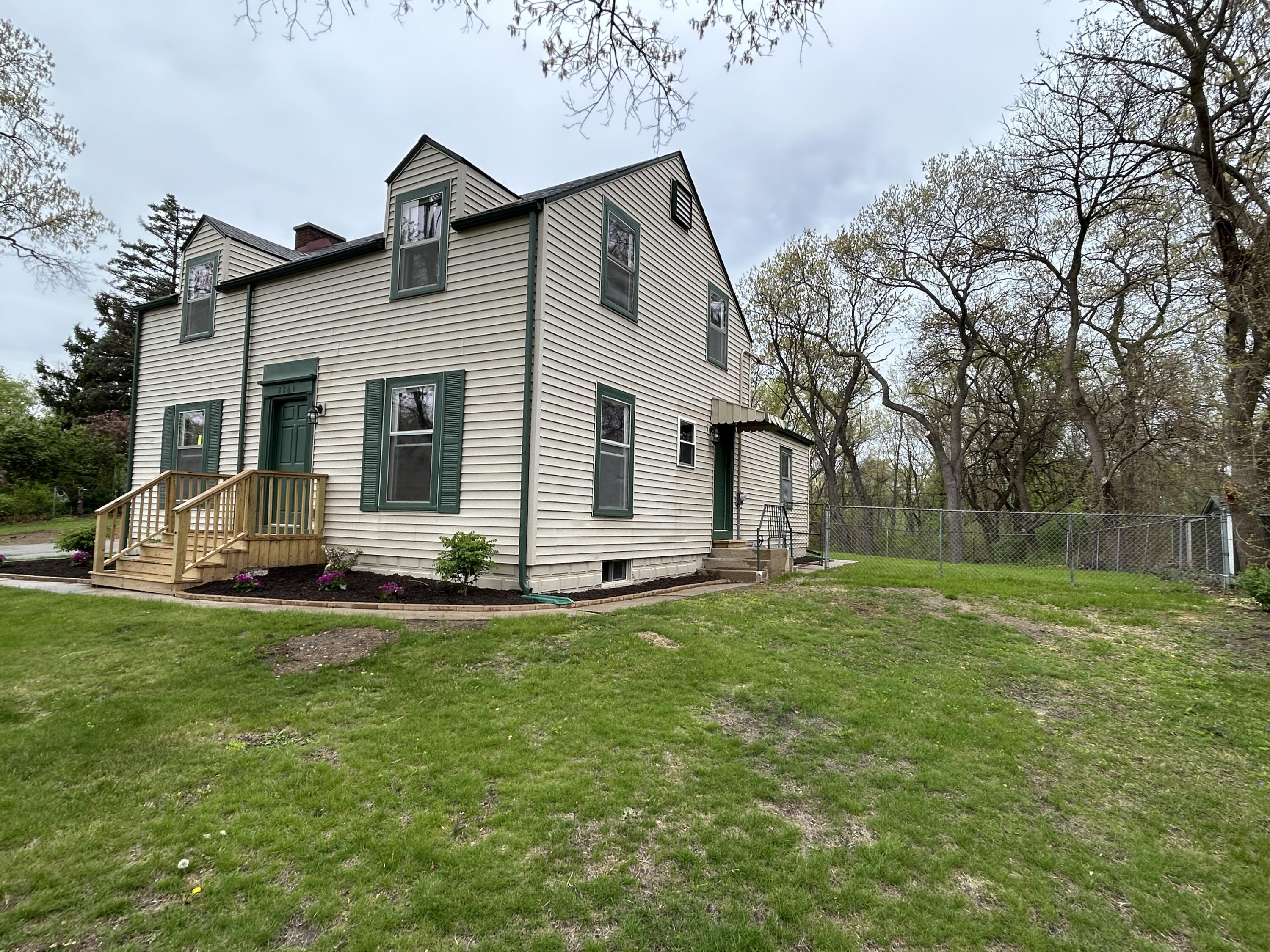 2264 Crest Road Gary, IN 46408 - Photo 5 of 86 a view of a house with a yard and sitting area