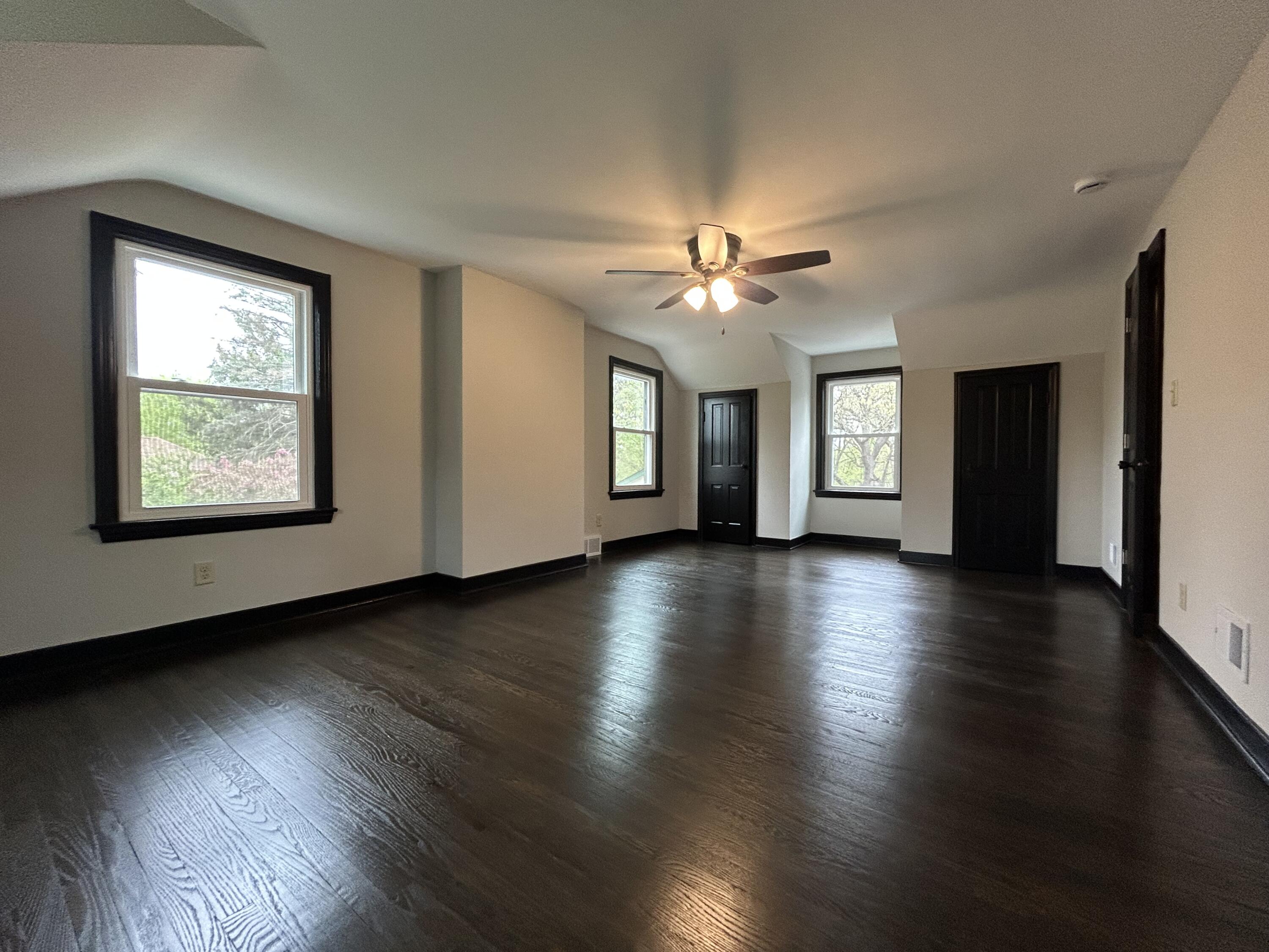 2264 Crest Road Gary, IN 46408 - Photo 54 of 86 an empty room with wooden floor and windows