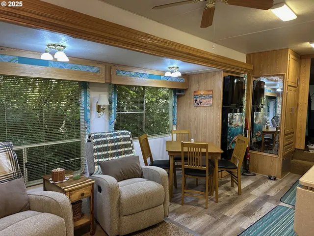 a view of a livingroom with furniture and wooden floor