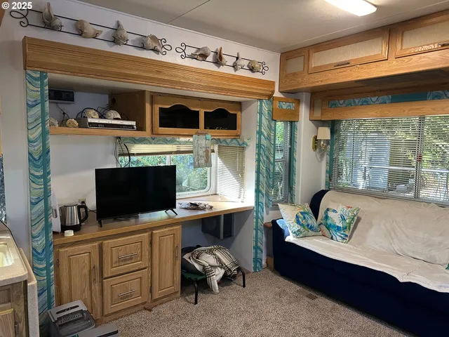 a room with furniture and a flat screen tv