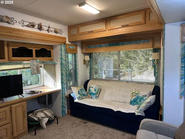 a living room with furniture and a window