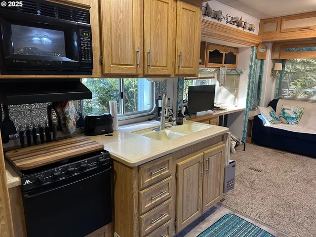 a kitchen with a stove and a microwave
